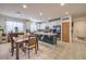 Open kitchen with white cabinets, stainless steel appliances, pantry, and adjacent dining area at 6733 Violet Bluff Ct, North Las Vegas, NV 89084