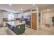 Modern kitchen with white cabinets, green island, and stainless steel appliances at 6733 Violet Bluff Ct, North Las Vegas, NV 89084