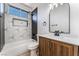 Modern bathroom with geometric tile and wood vanity at 6808 Rose Petal Ave, Las Vegas, NV 89130