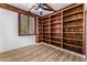 Bright bedroom with built-in shelving and ceiling fan at 6808 Rose Petal Ave, Las Vegas, NV 89130