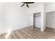 Bright bedroom with mirrored closet and wood floors at 6808 Rose Petal Ave, Las Vegas, NV 89130