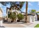 Two-story house with a three-car garage and manicured landscaping at 6808 Rose Petal Ave, Las Vegas, NV 89130