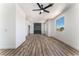 Living room with fireplace, hardwood floors, and ceiling fan at 6808 Rose Petal Ave, Las Vegas, NV 89130