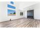 Bright living room with gray fireplace and wood-look floors at 6808 Rose Petal Ave, Las Vegas, NV 89130