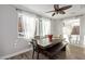 Bright dining room with wooden table and bench seating at 7131 Rosecrans St, Las Vegas, NV 89166