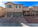 Two-story house with three-car garage and landscaped front yard at 7131 Rosecrans St, Las Vegas, NV 89166