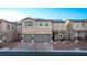 Two-story home with gray garage doors and solar panels at 7131 Rosecrans St, Las Vegas, NV 89166