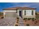 One-story home with tile roof, attached garage, and landscaped front yard at 732 Icy Fjord Ln, Henderson, NV 89015