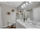 Modern bathroom with double vanity and large mirror at 7420 Bush Garden Ave, Las Vegas, NV 89129