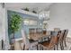 Elegant dining room featuring a large wooden table and chandelier at 7420 Bush Garden Ave, Las Vegas, NV 89129