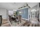 Elegant dining room with a large table, chandelier, and hardwood floors at 7420 Bush Garden Ave, Las Vegas, NV 89129