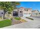 Two-story house with a three-car garage and landscaped front yard at 7420 Bush Garden Ave, Las Vegas, NV 89129