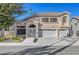 Two-story house with a three-car garage and landscaped front yard at 7420 Bush Garden Ave, Las Vegas, NV 89129