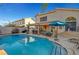 Inviting swimming pool with a large patio and covered seating area at 7420 Bush Garden Ave, Las Vegas, NV 89129