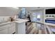 Convenient wet bar with white cabinets and a quartz countertop at 7420 Bush Garden Ave, Las Vegas, NV 89129