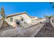 Private backyard with patio and gravel landscaping at 759 Whispering Palms Dr, Las Vegas, NV 89123