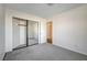 Bedroom with mirrored closet and access to hallway at 759 Whispering Palms Dr, Las Vegas, NV 89123