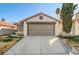 Single-story house with attached garage and landscaped front yard at 759 Whispering Palms Dr, Las Vegas, NV 89123