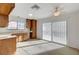 Kitchen with wood cabinets and sliding glass door at 759 Whispering Palms Dr, Las Vegas, NV 89123