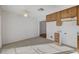 Kitchen area with wood cabinets and tile floor at 759 Whispering Palms Dr, Las Vegas, NV 89123