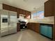 Kitchen with stainless steel appliances and teal dishwasher at 759 Whispering Palms Dr, Las Vegas, NV 89123