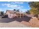 Covered patio with seating, grill, and desert landscaping at 848 Waterloo Dr, Henderson, NV 89002