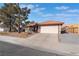 One-story home with terracotta roof, attached garage, and desert landscaping at 848 Waterloo Dr, Henderson, NV 89002