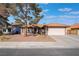 Single-story house with a terracotta tile roof, attached garage, and landscaped front yard at 848 Waterloo Dr, Henderson, NV 89002