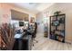 Home office with a large desk and shelving unit at 848 Waterloo Dr, Henderson, NV 89002