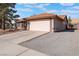 Single-story home with attached garage and desert landscaping at 848 Waterloo Dr, Henderson, NV 89002