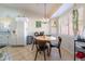 Kitchen with white cabinets, a round dining table, and a chandelier at 848 Waterloo Dr, Henderson, NV 89002