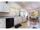 Well-equipped kitchen featuring white cabinets, black dishwasher, and ample counter space at 848 Waterloo Dr, Henderson, NV 89002