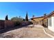 Covered patio and expansive backyard with block wall at 8517 Soneto Ln, Las Vegas, NV 89117