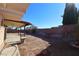 Covered patio, large backyard, and block wall at 8517 Soneto Ln, Las Vegas, NV 89117