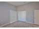 Bedroom with double door closets and wood-look floors at 8517 Soneto Ln, Las Vegas, NV 89117