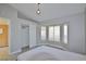 Bright bedroom with bay window, closet, and laminate flooring at 8517 Soneto Ln, Las Vegas, NV 89117