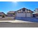 Single-story house with red tile roof and two-car garage at 8517 Soneto Ln, Las Vegas, NV 89117