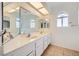 Bathroom features a double vanity and large mirror at 8633 Portofino Ct, Las Vegas, NV 89117