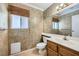 Clean bathroom with updated vanity and large mirror at 8633 Portofino Ct, Las Vegas, NV 89117