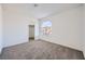 Charming bedroom with neutral carpeting and large window at 8633 Portofino Ct, Las Vegas, NV 89117