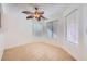 Bright dining room with tile floor, ceiling fan, and large windows at 8633 Portofino Ct, Las Vegas, NV 89117