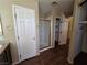 Bathroom with shower, linen closet, and wood-look floors at 865 Gleamstar Ave, Las Vegas, NV 89123