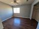 Bedroom with wood-look floors, ceiling fan, and closet at 865 Gleamstar Ave, Las Vegas, NV 89123