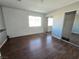 Spacious bedroom with mirrored closet doors and wood-look flooring at 865 Gleamstar Ave, Las Vegas, NV 89123