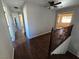 Upstairs hallway with wood-look floors and ceiling fan at 865 Gleamstar Ave, Las Vegas, NV 89123