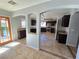 Open kitchen with breakfast bar and view into dining area at 865 Gleamstar Ave, Las Vegas, NV 89123