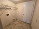 Laundry room with shelving and built-in washer/dryer hookups at 865 Gleamstar Ave, Las Vegas, NV 89123