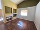 Living room with fireplace and wood-look flooring at 865 Gleamstar Ave, Las Vegas, NV 89123