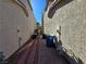 Neat side yard with brick pathway and utility access at 865 Gleamstar Ave, Las Vegas, NV 89123