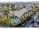 Aerial view of house with pool and neighborhood in background at 8986 Lillyhammer Ct, Las Vegas, NV 89147